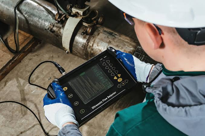 UT technician carrying out ultrasonic testing on an offshore structural member